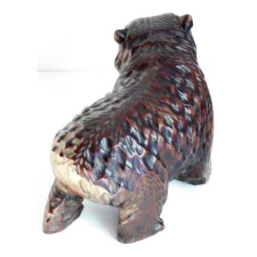 557 - A good and heavy late 19th century carved Black Forest bear; standing four square, with open mouth a... 