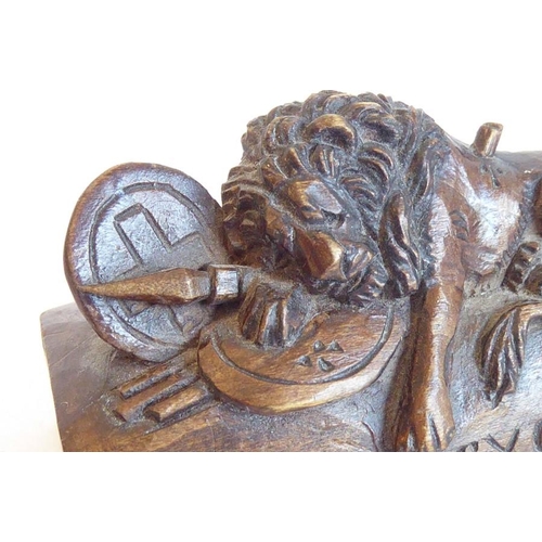 573 - A circa late 19th/early 20th century small carved wooden model of the 'Lion of Lucerne' after Thorva... 