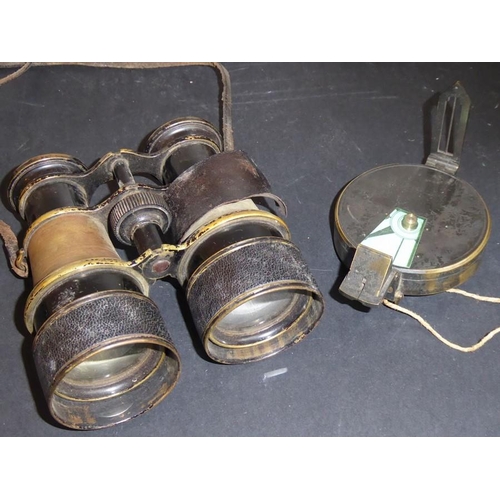 574 - A pair of late 19th century leather-cased field glasses in used condition, together with a hand-stit... 