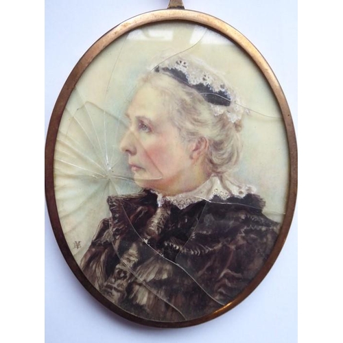 576 - A cased late 19th/early 20th century rose-coloured, metal-framed oval shoulder-length female portrai... 