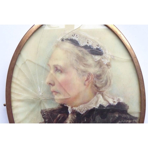 576 - A cased late 19th/early 20th century rose-coloured, metal-framed oval shoulder-length female portrai... 