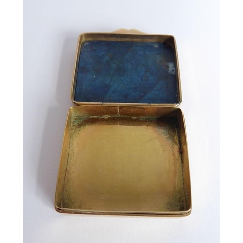 578 - A small gilt-metal snuff box; set with a rectangular lapis lazuli top (3.5cm wide)