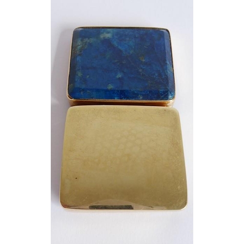 578 - A small gilt-metal snuff box; set with a rectangular lapis lazuli top (3.5cm wide)