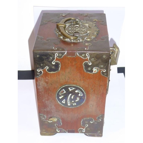 581 - A late 19th century Chinese brass bound hardwood table cabinet, the swing handle as a Shou character... 