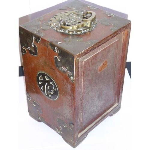 581 - A late 19th century Chinese brass bound hardwood table cabinet, the swing handle as a Shou character... 