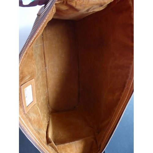 583 - A genuine hand-stitched tan-leather trimmed Louis Vuitton carry bag (Paris, France); applied hand-st... 