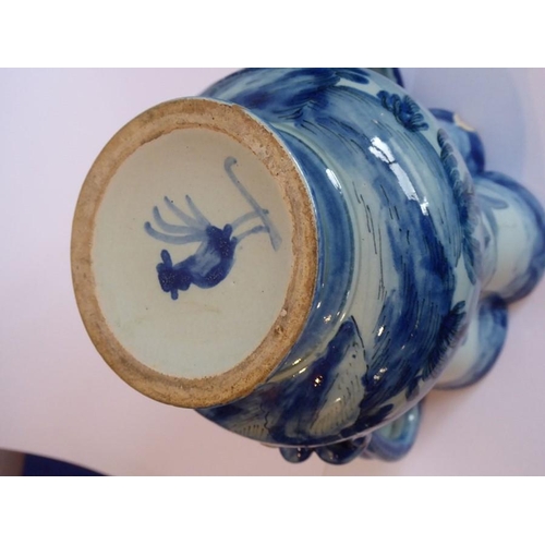 59 - A 19th century Cantagalli two-handled tin glazed earthenware vase decorated with a single cherub fly... 