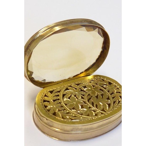 596 - A rare late 18th/early 19th century oval gold vinaigrette; the large hand-cut citrine with faceted e... 