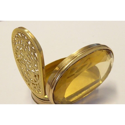 596 - A rare late 18th/early 19th century oval gold vinaigrette; the large hand-cut citrine with faceted e... 