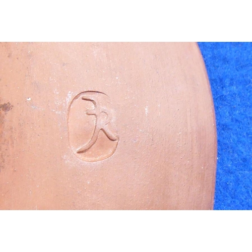 61 - A Studio-ware style terracotta slipware glazed dish of oval section; impressed monogram to underside... 