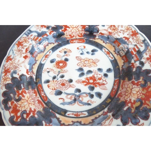 63 - A pair of late 18th/early 19th century Japanese porcelain dishes decorated in the Imari palette with... 