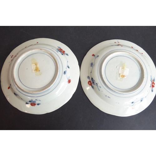 63 - A pair of late 18th/early 19th century Japanese porcelain dishes decorated in the Imari palette with... 