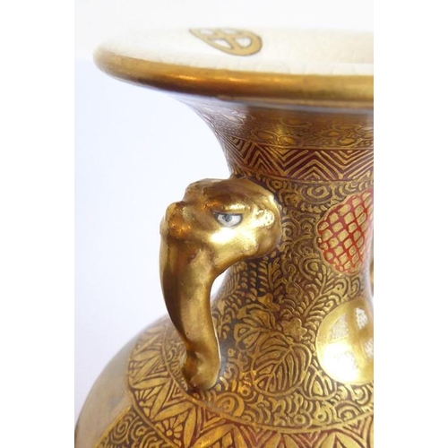 65 - A small early 20th century Japanese two-handled vase, circa 1900; enamelled and gilt with a lady pai... 