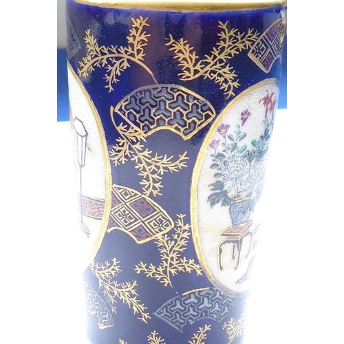 68 - A good and small cylindrical Japanese porcelain spill vase, circa 1900; decorated with two opposing ... 