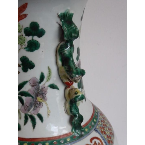 74 - A large mid 19th century Chinese porcelain vase; the flaring rim above a waisted neck decorated in e... 