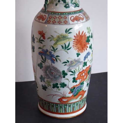 74 - A large mid 19th century Chinese porcelain vase; the flaring rim above a waisted neck decorated in e... 