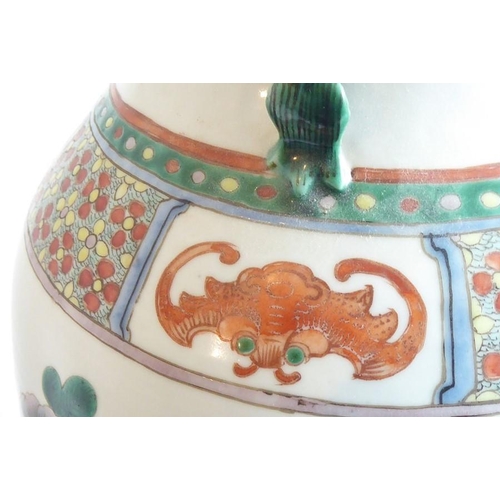 74 - A large mid 19th century Chinese porcelain vase; the flaring rim above a waisted neck decorated in e... 