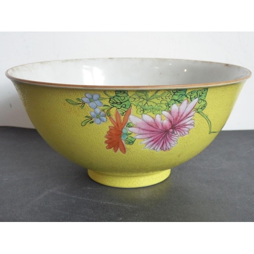 77 - A 19th century Chinese porcelain yellow ground scrafitto bowl; the feathery-scroll incised ground pa... 