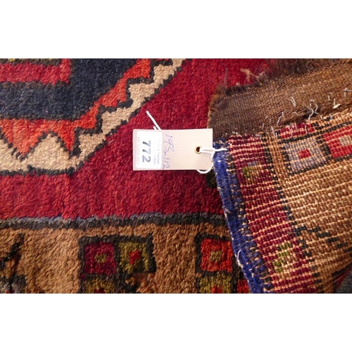 772 - A Karabagh rug with red ground, Caucasus (cut) 173cm x 112cm