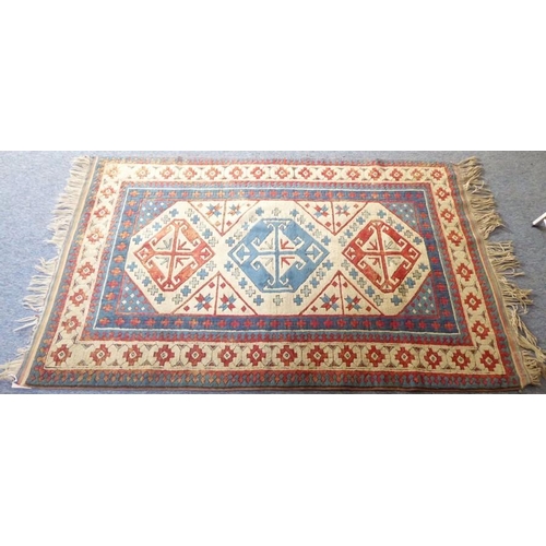 776 - A Turkish Melas rug; three central lozenges against a beige ground (XXXcm x 128cm)