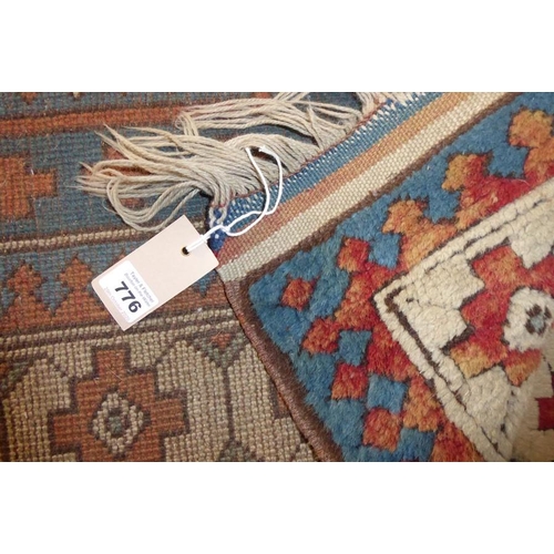 776 - A Turkish Melas rug; three central lozenges against a beige ground (XXXcm x 128cm)