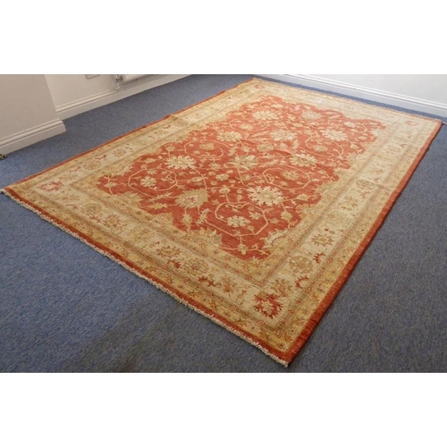 795 - A large modern Afghan Ziegler carpet of predominately light-plum colour with beige borders (300cm x ... 