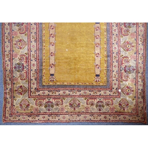 818 - A 19th century Turkish silk prayer rug having unusual yellow ground centre (184cm x 124cm)