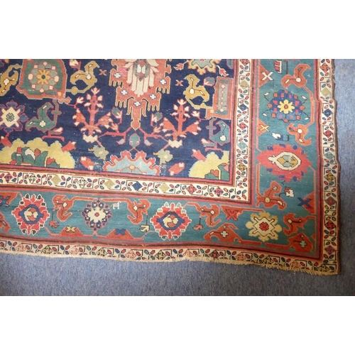 826 - A good mid-19th century north-west Persia corridor carpet; signed and dated 125?, (some wear and red... 