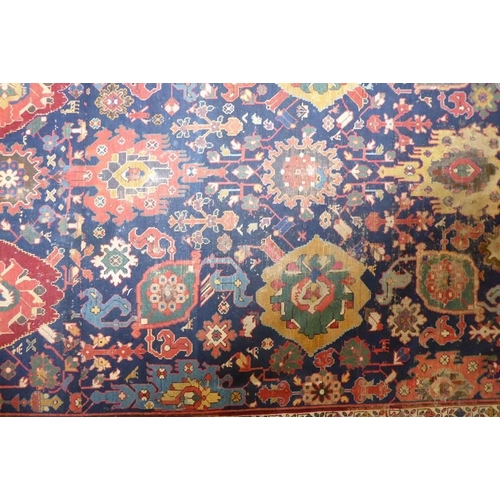 826 - A good mid-19th century north-west Persia corridor carpet; signed and dated 125?, (some wear and red... 