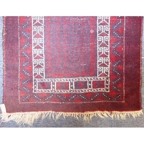 836 - A 20th century Baloch prayer rug, predominately red ground (142cm x 87cm)