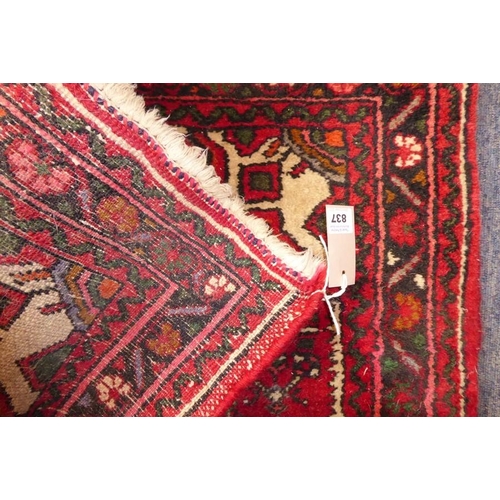 837 - A long north-west Persia Hamadan runner with red ground (297cm x 84cm)