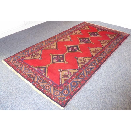 841 - A 20th century Hamadan rug with red ground (226cm x 128cm)