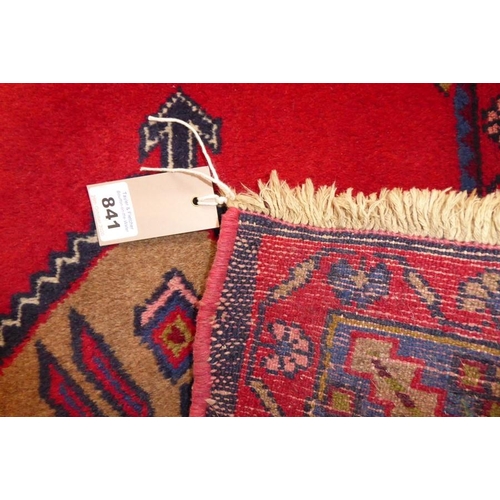 841 - A 20th century Hamadan rug with red ground (226cm x 128cm)