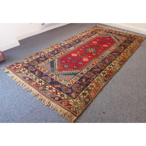 844 - A Turkish Melas corridor carpet decorated with a tree of life design (fire damage) (approx. 264cm x ... 