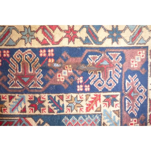 844 - A Turkish Melas corridor carpet decorated with a tree of life design (fire damage) (approx. 264cm x ... 