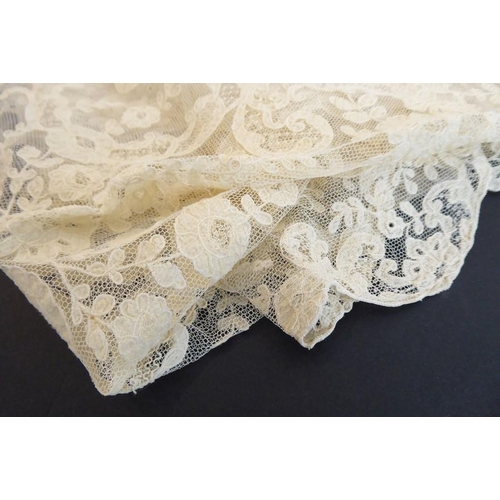 849 - A circa 1890s cream-coloured wedding veil in Brussels lace with floral motifs. Provenance: Worn by A... 