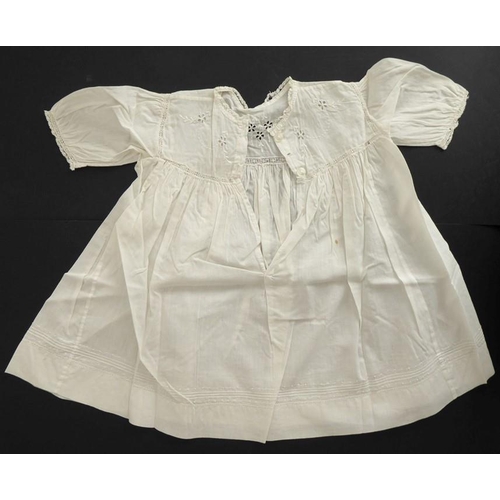 859 - A circa 1930s child's dress; cotton lawn with white work detailing on yoke, C.B. opening