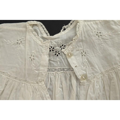 859 - A circa 1930s child's dress; cotton lawn with white work detailing on yoke, C.B. opening