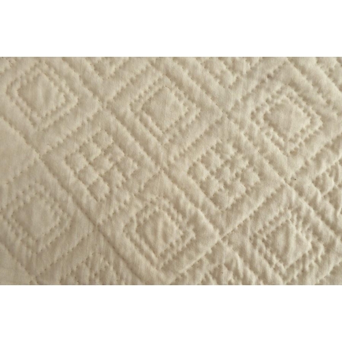 862 - A hand-stitched, double sided, all-white Durham quilt; central four-point motif radiating with leaf ... 