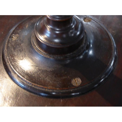 863 - A small George III circular mahogany urn style table; the galleried balustraded top above turned ste... 