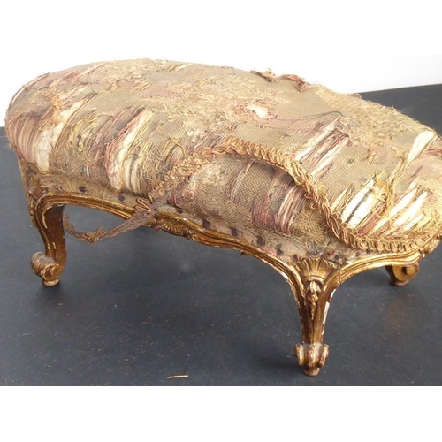 868 - A 19th century carved kidney-shaped gilt-wood stool in Louis XV-style; original upholstery above thr... 