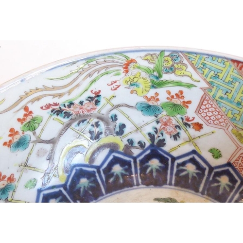 88 - A large 19th century Chinese porcelain punch bowl; centrally decorated with a mythical qilin-style c... 