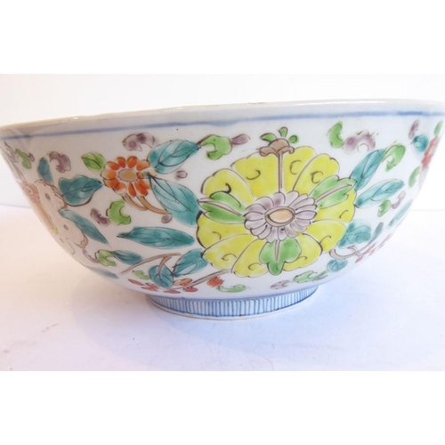 88 - A large 19th century Chinese porcelain punch bowl; centrally decorated with a mythical qilin-style c... 