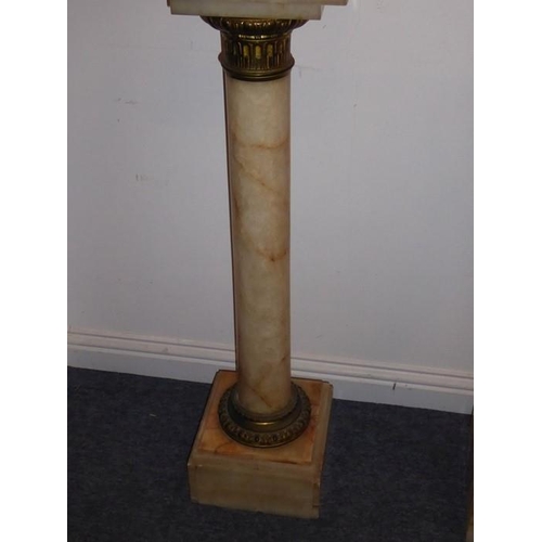 884 - A pair of 19th century veined-marble and gilt-metal mounted pedestal stands of columnar form; each s... 