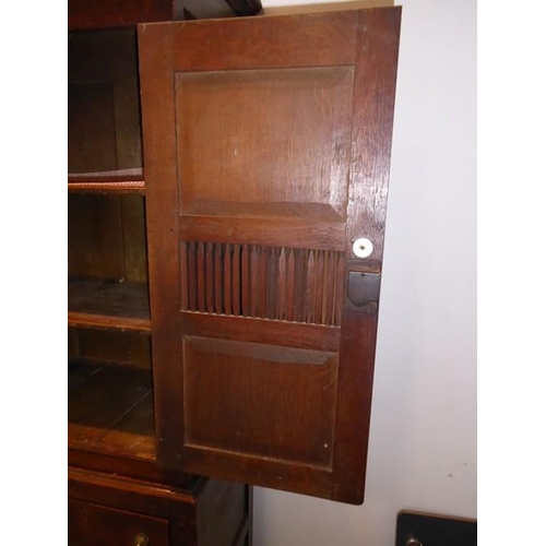 892 - A good 18th century North Country-style oak food cupboard of slim proportions; outset cornice above ... 