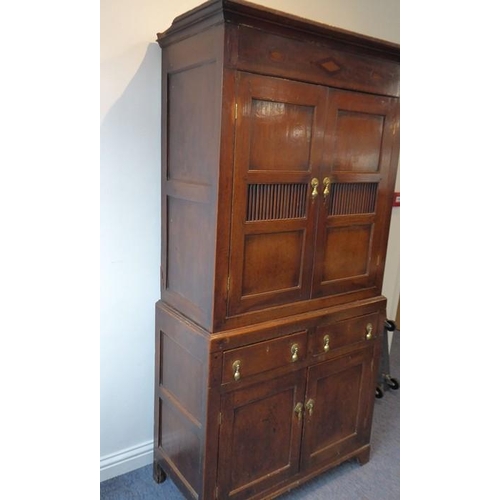 892 - A good 18th century North Country-style oak food cupboard of slim proportions; outset cornice above ... 