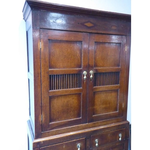 892 - A good 18th century North Country-style oak food cupboard of slim proportions; outset cornice above ... 