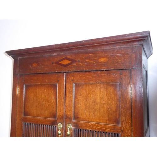 892 - A good 18th century North Country-style oak food cupboard of slim proportions; outset cornice above ... 