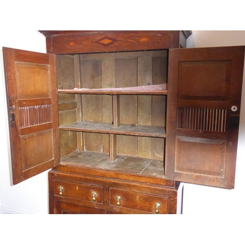 892 - A good 18th century North Country-style oak food cupboard of slim proportions; outset cornice above ... 