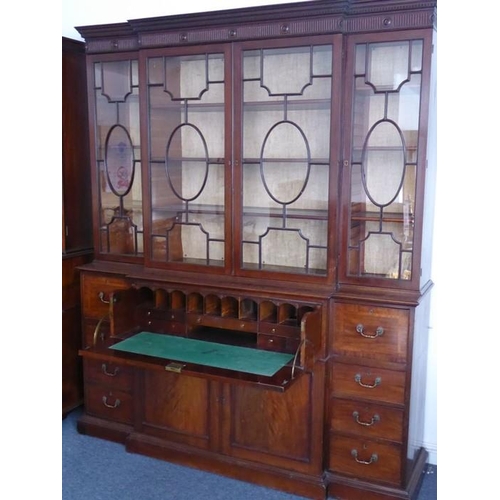 903 - A very fine late 18th century breakfront mahogany library secretaire bookcase; the dentil cornice ab... 